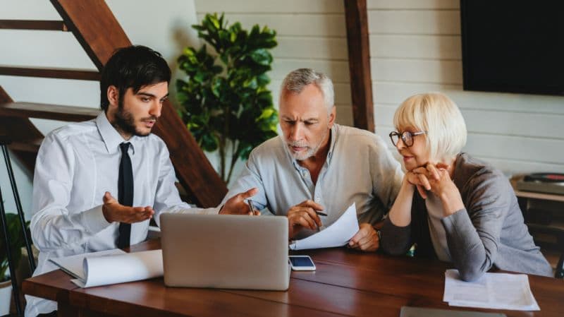 A couple listening to insurance advisor about disability insurance