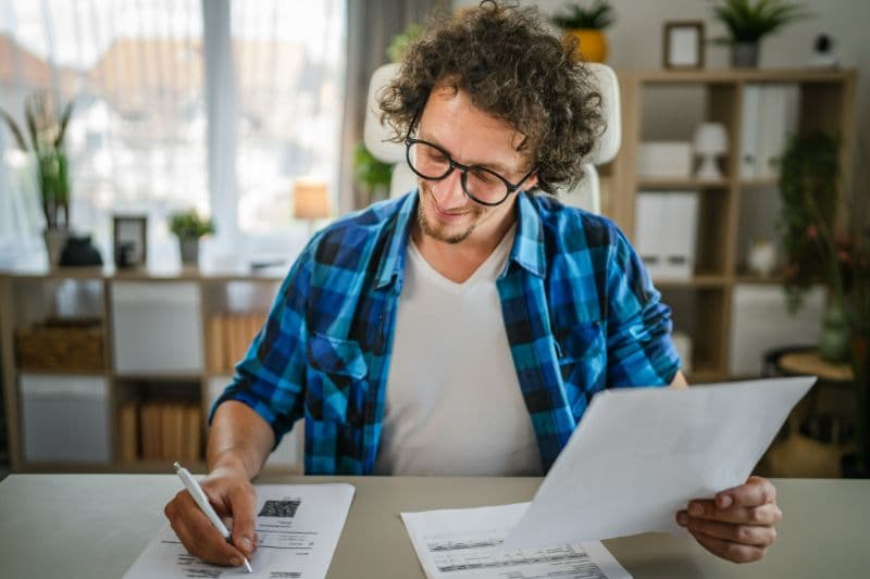 Worker in office comparing insurance options